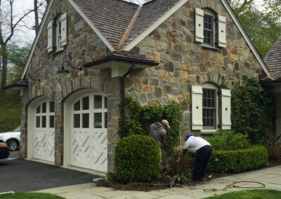 Modern home renovation, expertly installed mosaic natural stone veneer on residential exterior.